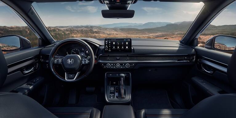 2027 Honda CR-V dashboard with touchscreen infotainment and steering wheel (Compact Crossover SUV).